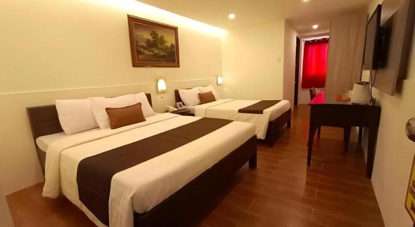 Hotel Asuncion Laoag Bagian luar foto